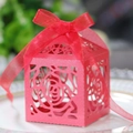 Detail of red laser-cut candy box with rose patterns and an elegant silk ribbon bow - Pearlescent Red