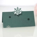 Macro shot of dark green laser-cut snowflake place card made of premium pearlescent paper - Pearlescent Dark Green