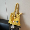 Yellow hand-woven knit tote bag featuring colorful 3D floral accents for women - Yellow
