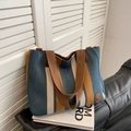 Canvas-Tragetasche mit dunkelblauen, ingwerfarbenen und beige Streifen und braunen Henkeln - Blau