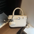 Chic beige lychee textured handbag with heart charm and detachable crossbody strap - Off White
