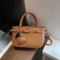 Brown litchi grain leather mini bag with heart charm and adjustable shoulder strap - Brown