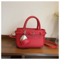 Red litchi grain shoulder bag with decorative belt buckle and heart-shaped charm - Red