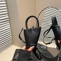 Minimalist black lychee texture leather bucket bag with silver lettering and top handle - Black