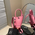 Pink asymmetrical bucket bag with lychee texture and silver hardware details - Pink