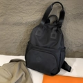 Fashionable black nylon backpack with multi-compartments and water-resistant finish - Black