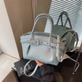 Elegant light blue lychee pattern leather handbag with adjustable crossbody strap - Blue