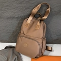 Brown nylon commuter backpack with multiple zipper pockets and adjustable straps - Khaki