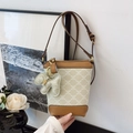 Chic bucket bag in ivory canvas with geometric patterns and caramel leather trim - Milky Green