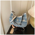 Detail of vintage denim moon bag with metallic butterfly accents and silver PU leather strap - Denim Blue