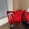 Chic vibrant red PU leather tote bag with elegant pearl lace bow and golden logo - Burgundy