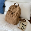 Brown nylon drawstring backpack with pleated texture and adjustable cords for urban style - Khaki