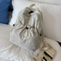 Beige nylon drawstring backpack with pleated texture and large front storage pocket - White