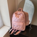 Pink quilted backpack with heart patterns and woven zipper pulls in stylish soft nylon - Pink