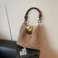 Brown woven straw hobo bag with dark wood bead handles and intricate hollow patterns - Khaki