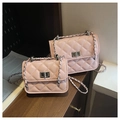 Pink quilted crossbody bag set with diamond patterns and metal chain straps on wooden shelf - Large / Pink