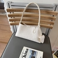 Creamy white woven leather underarm bag with a chic minimalist aesthetic - White