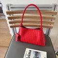 Chic red woven underarm bag featuring premium braided leather and knot detail - Red