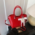 Red patent leather bucket bag with white lace bow and pearl heart charm detail - Red with Pendant
