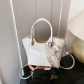 Elegant cream bucket bag in glossy leather with pearl heart charm and dual handles - White with Pendant