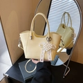 Pale yellow pleated bucket bag with lace bow and pearl charm shown in mirror reflection - Yellow with Pendant