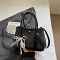 Chic black bucket bag with white polka dots and lace bow charm on grey blazer - Black with Pendant