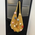 Bright yellow handmade crochet tote bag with colorful 3D floral accents and wide strap - Yellow