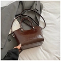 Deep brown oil wax leather bucket bag with top handles and shoulder strap in 2026 style - Brown No Pendant