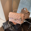Pink quilted crossbody bag with gold chain strap and metal ball adjuster charm - Pink