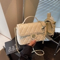Elegant cream quilted crossbody bag with gold chain strap and turn-lock closure - Off White