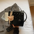 Black glossy PU leather handbag with silver buckle, stud detailing and plush bear charm - Black