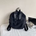 Lightweight black commuter backpack with adjustable straps and spacious side pockets - Black