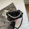 Chic black pleated cloud bag with glossy finish and large pearl strap detail - Black