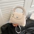 Chic beige crossbody bag with vertical pleated texture and silver metallic twist lock - White