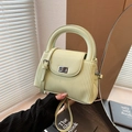 Quilted light green crossbody bag with silver twist lock and pleated side textures - Green