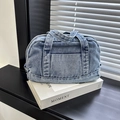 Bolso de mano de mezclilla azul lavado con asas dobles y bolsillo frontal casual - Azul claro