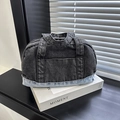 Two-tone denim tote bag featuring dark grey and light blue patchwork with round handles - Black and Blue