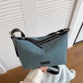 Blue denim fabric dumpling bag with black leather straps and silver metal zipper - Black