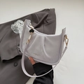 Chic light purple leather bucket bag with heart chain and adjustable crossbody strap - Purple