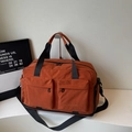 Caramel orange large travel bag with multiple pockets and adjustable shoulder strap - Orange