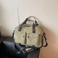 Olive green travel duffel bag with dual front pockets and adjustable shoulder strap - Green