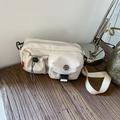 Creamy white canvas crossbody bag with multi-pocket utility design and black buckle - Off White