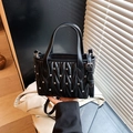 Black quilted small tote bag with silver studs and adjustable shoulder strap style - Black