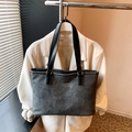 Dark gray textured tote bag with gold lettering and black handles for daily use - Black