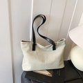 Minimalist beige canvas tote bag with black leather straps and gold fashion logo - Beige