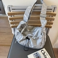 Silver pleated dumpling crossbody bag with metallic texture and heart charm - Silver