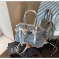 Detail of denim and silver leather crossbody bag with lace bow and metal lock - Blue with Charm