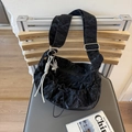 Black pleated dumpling hobo bag with wide strap and silver butterfly pendant detail - Black