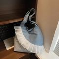 Light blue denim tote bag featuring decorative white organza ruffle trim and long shoulder straps - Blue