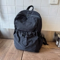 Minimalist black nylon backpack with drawstring pocket and durable top handle for women - Black